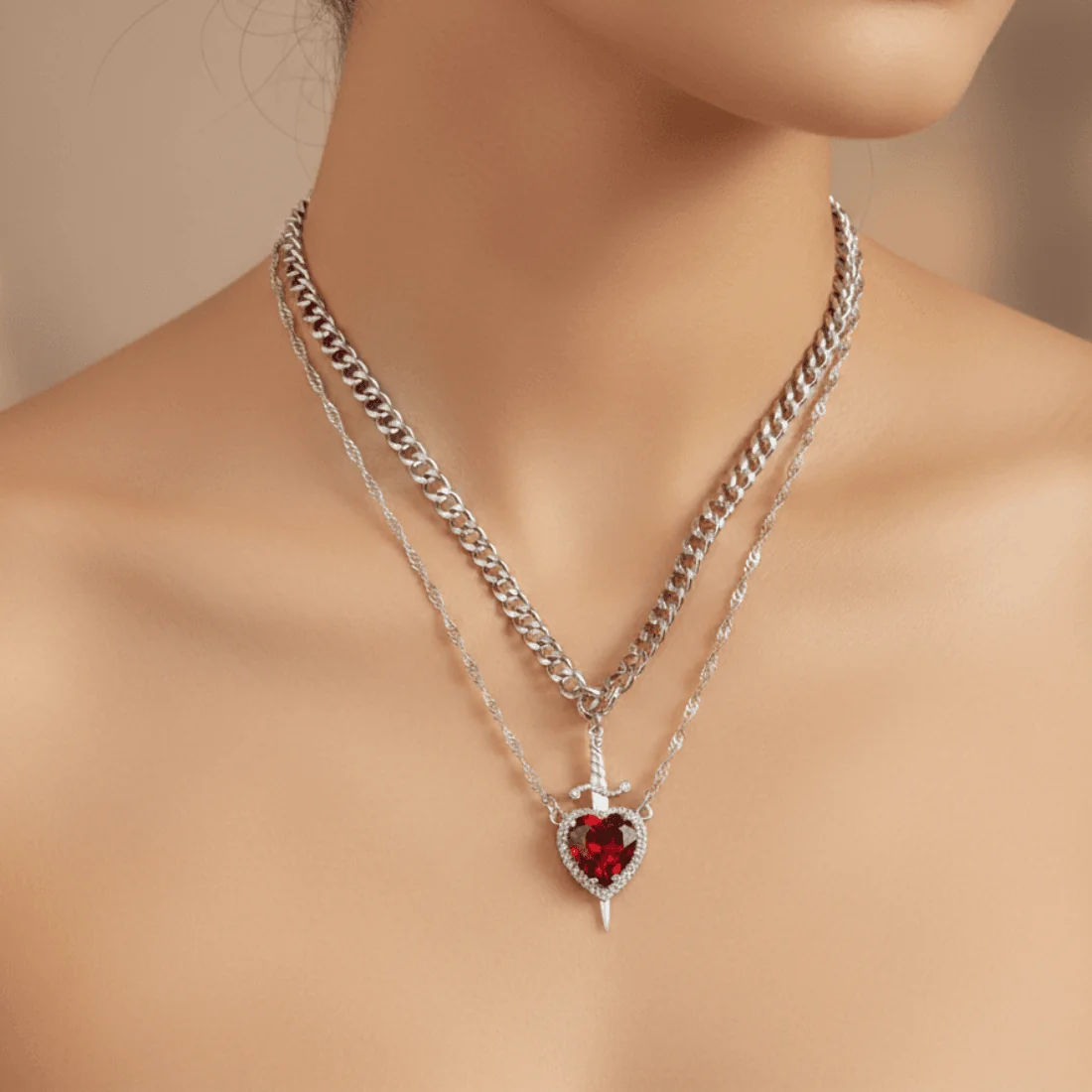 Подвійне намисто-чокер Серце та Кинджал зі сріблястого металу з червоним кристалом.